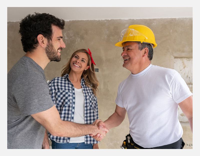 Contractor and home owner shaking hands