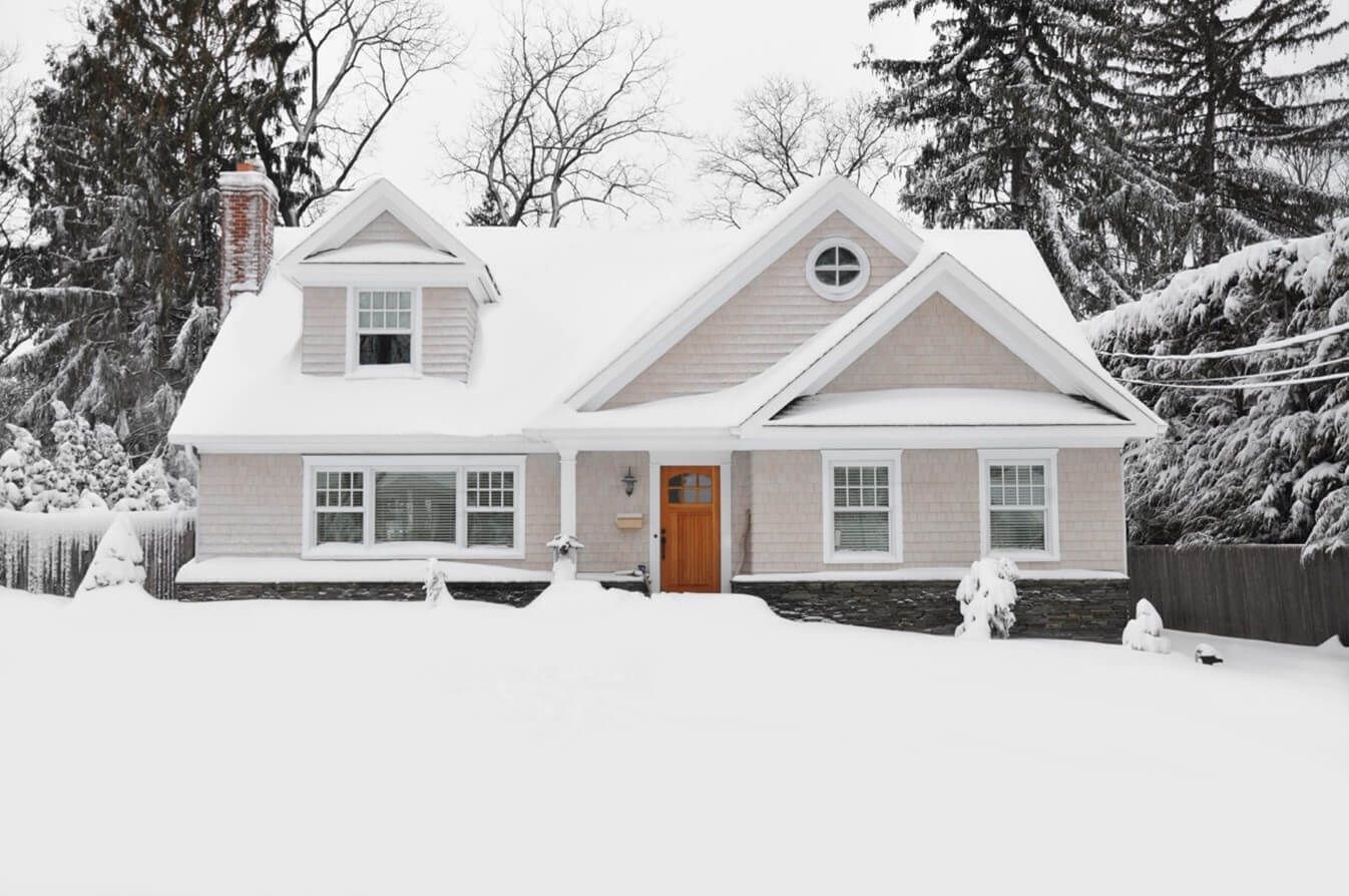 A home covered in snow lacks the curb appeal you see in the spring/summer months.