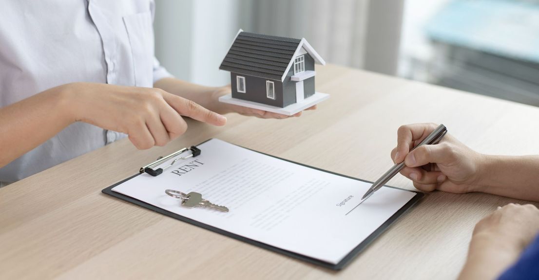 person signing a rental agreement