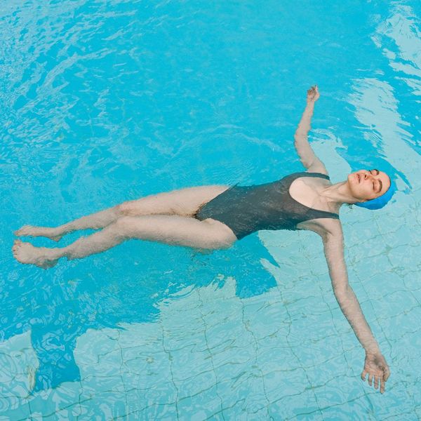 Woman relaxing in a pool