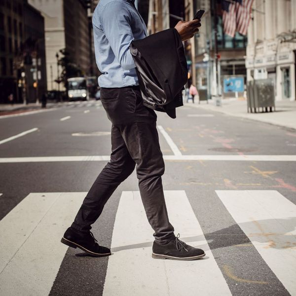 man walking in crosswalk