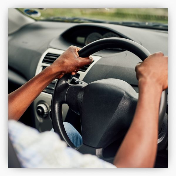 Hands holding tightly to a wheel