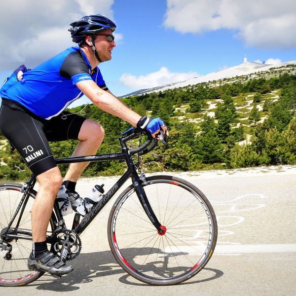 man with a helmet on a bicycle