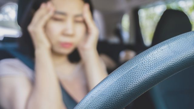 women stressed behind the wheel