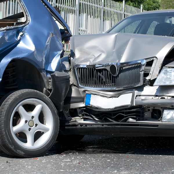 Image of a traffic collision where one car rear-ended another,