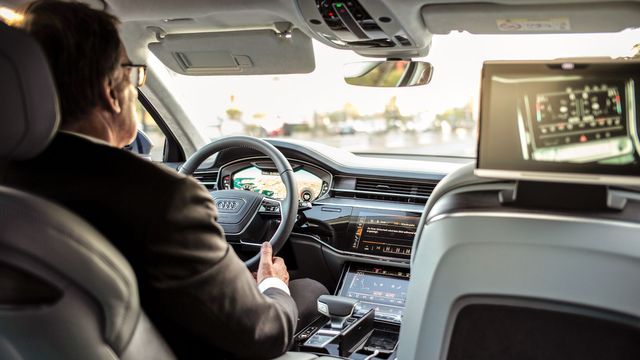 man driving car