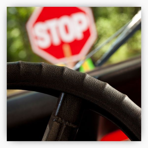 Stop sign and drivers wheel