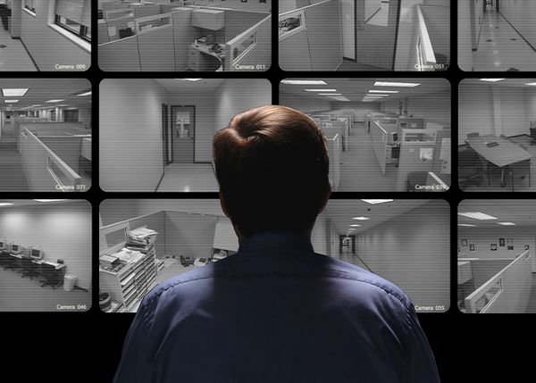 a security guard watching monitors