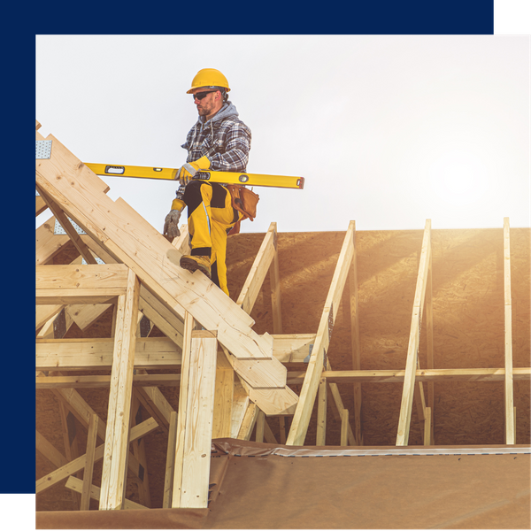 Man standing on top of a building under construction