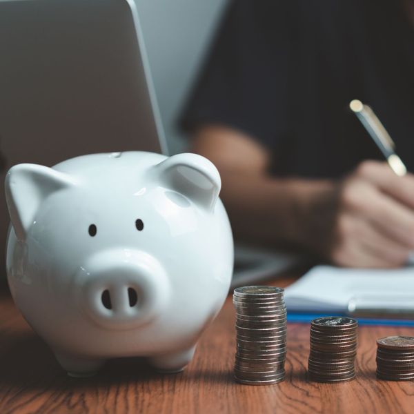 piggy bank with coins beside it piggy bank with coins beside it