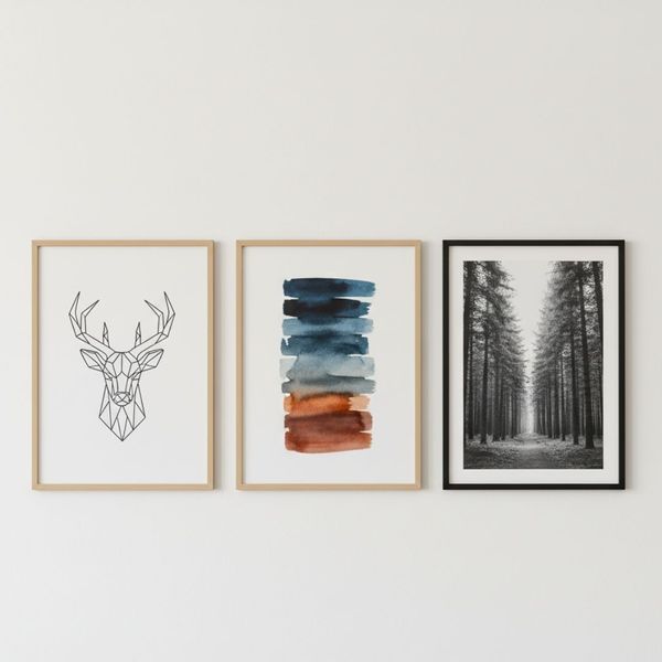 Modern gallery wall featuring three framed art pieces Modern gallery wall featuring three framed art pieces