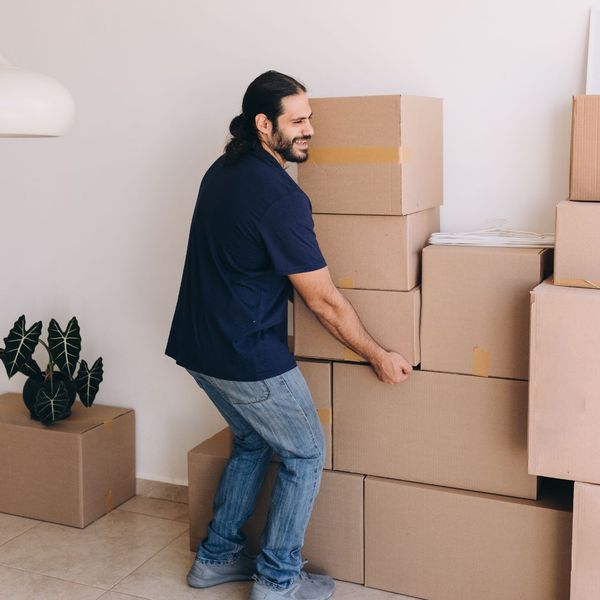 man moving boxes man moving boxes