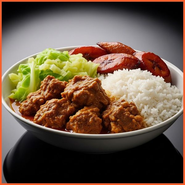 A rich bowl of Jamaican curry goat with rice, cabbage, and plantains A rich bowl of Jamaican curry goat with rice, cabbage, and plantains