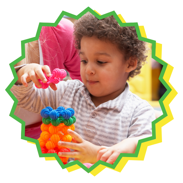 a child stacking toys Creole Speaking Daycare (4).png