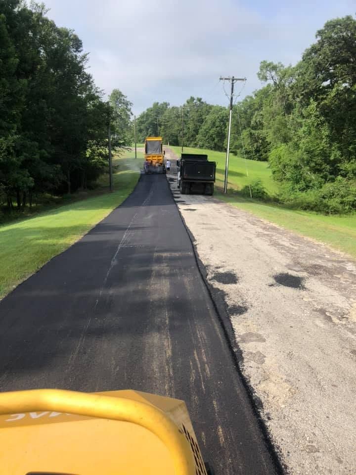 Half paved road with paving trucks Paving 2