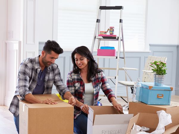 A couple packing up for a move.