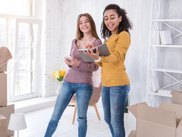 Two teens moving into a room
