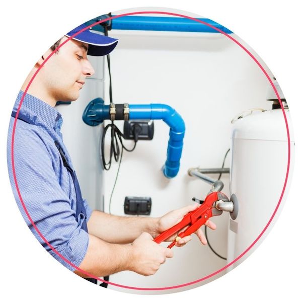 Plumber repairing a water heater