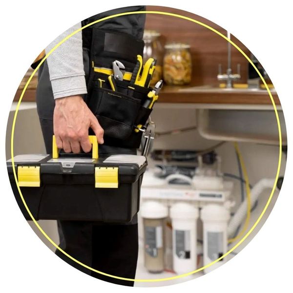 Plumber repairing a sink