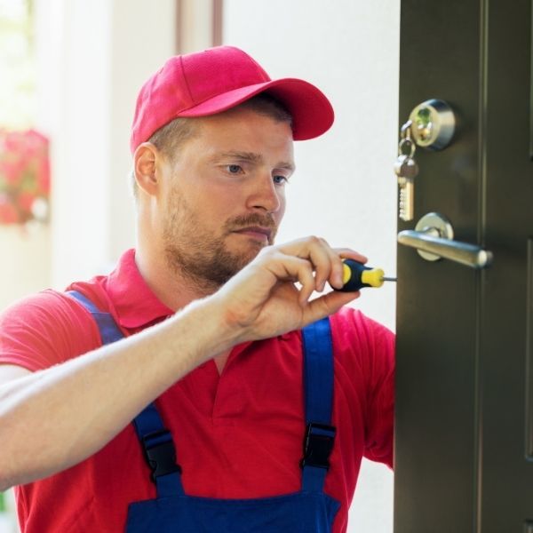 Locksmith unlocking a door