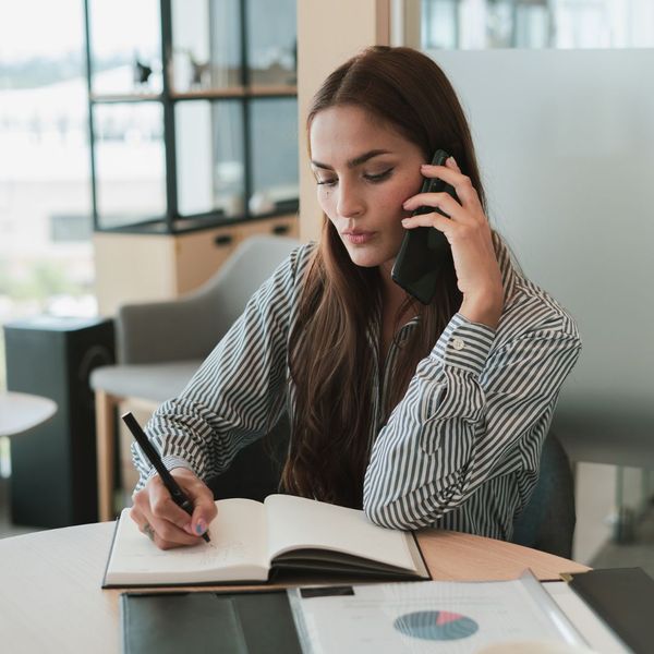 Woman talking on phone.