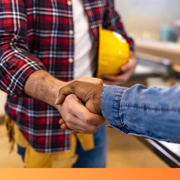 contractor shaking hands with client