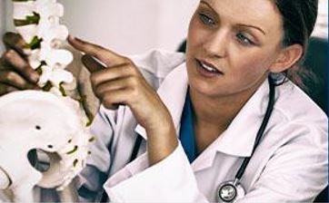 DC Doctor examines spine.JPG
