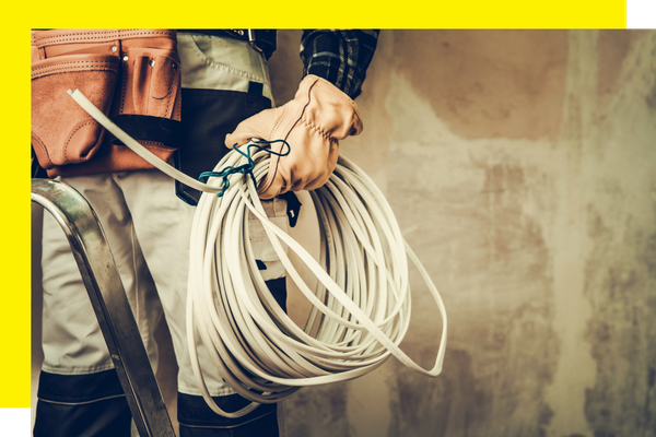 Person holding electrical wires 