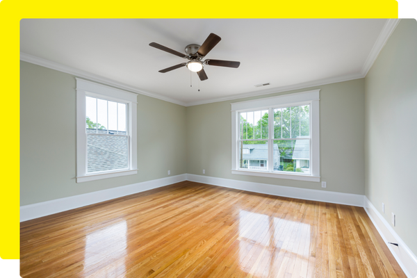 ceiling fan in empty room with wood flooring