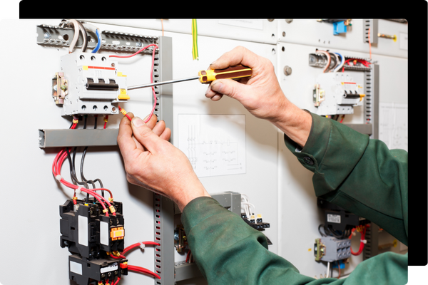 electrician working on an electrical panel
