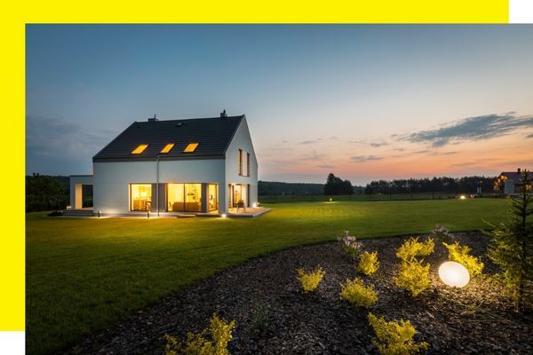 home at night with lighting both indoors and outdoors home at night with lighting both indoors and outdoors