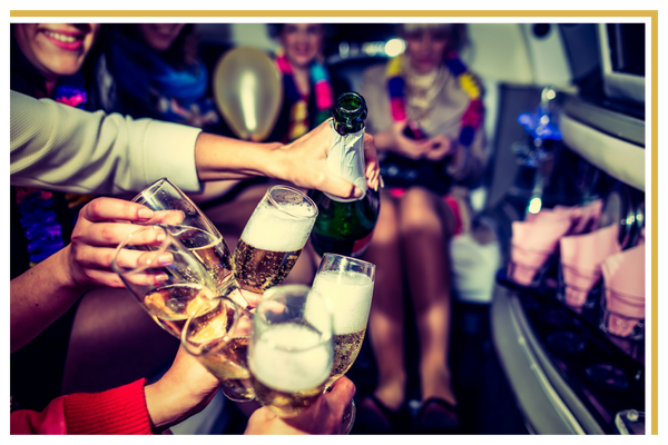 Pouring champagne in a party bus Party Bus Rentals-2.png