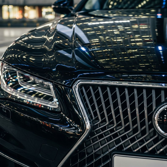 The front grille and emblem of a luxury executive vehicle