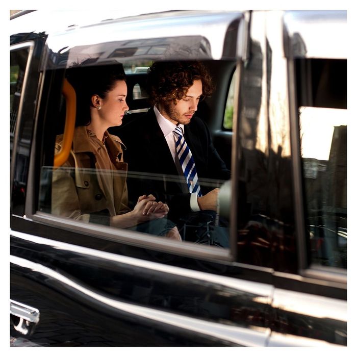 professionals sitting in vehicle