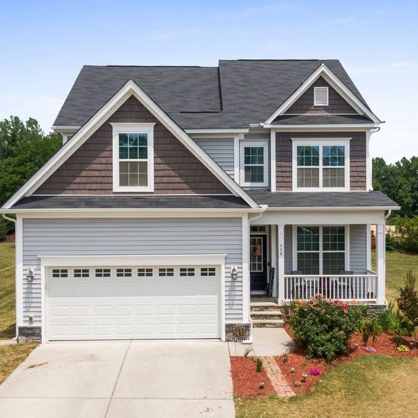 house with garage in summertime