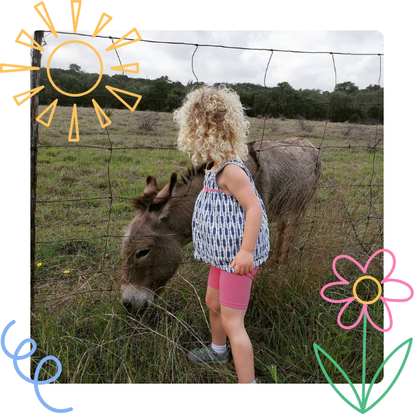 kid with a donkey