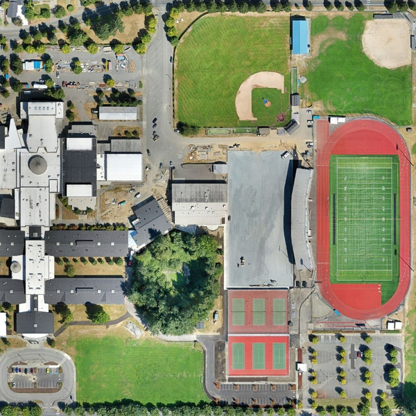 aerial photo of school and football field