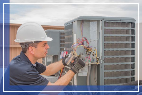 hvac technician working on unit