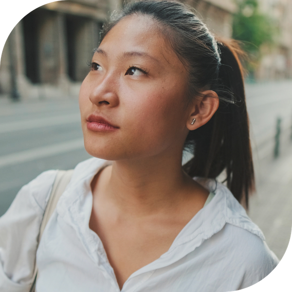 woman looking around city