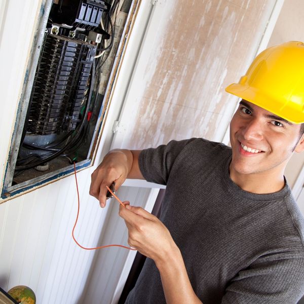 electrician with electrical panel