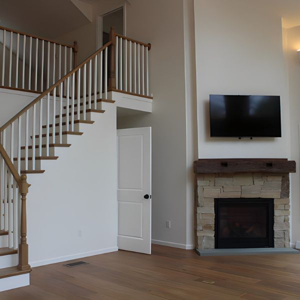 stairs and fireplace in a custom stick home