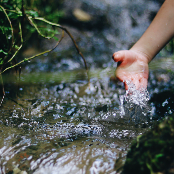sticking hand in flowing water sticking hand in flowing water