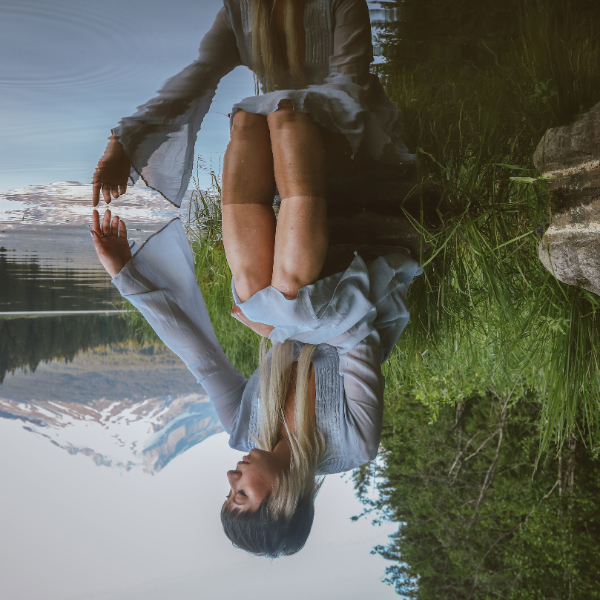 abstract image of woman reflected in water