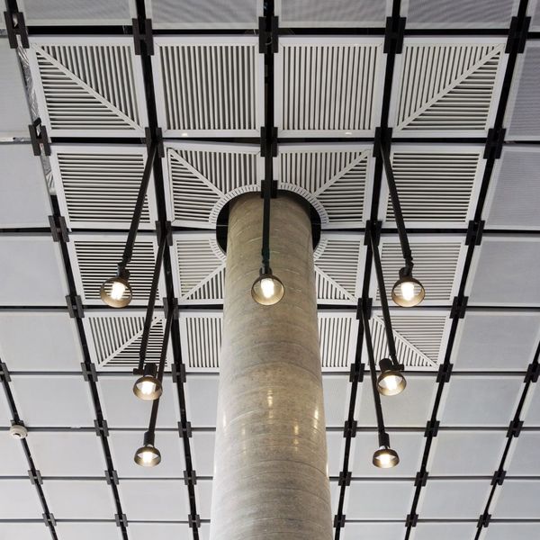 Suspended ceiling with lights hanging from it. 