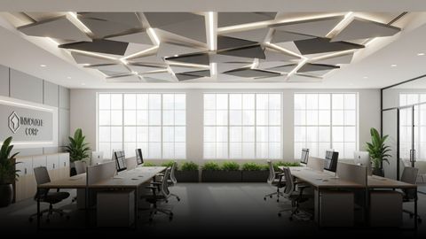 A modern office space with a white acoustic tile ceiling.