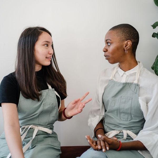 two women speaking to each other