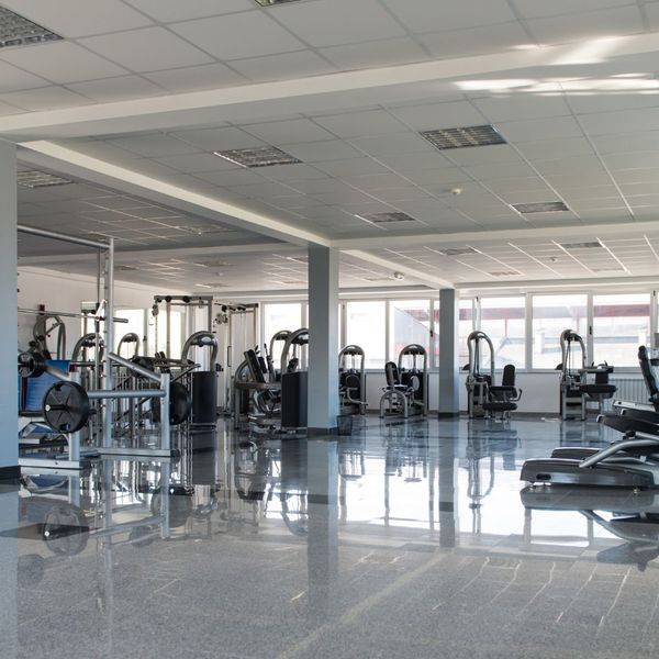 Commercial fitness gym with acoustic ceiling tiles