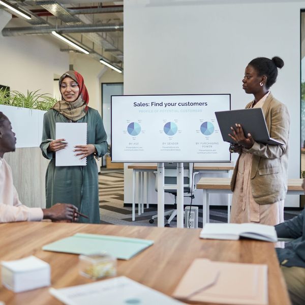 professionals sharing a presentation at work