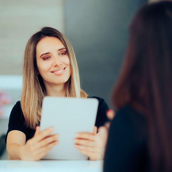 medical receptionist speaking to patient