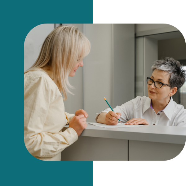 patient checking in with receptionist